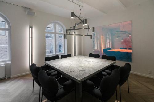 a dining room with a table and chairs at Hotel Ottilia in Copenhagen