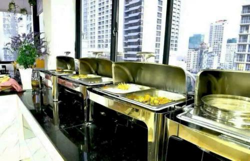 a row of food stations in a restaurant at Hola Nha Trang hotel in Nha Trang