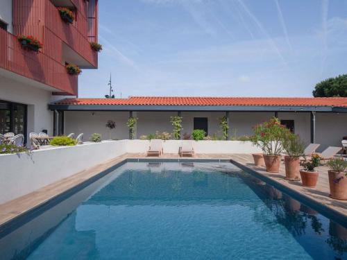 a swimming pool in the backyard of a house at ibis Montauban in Montauban
