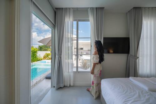 Postel nebo postele na pokoji v ubytování MiraMaya Luxury Mountain View Private Pool Villa 5