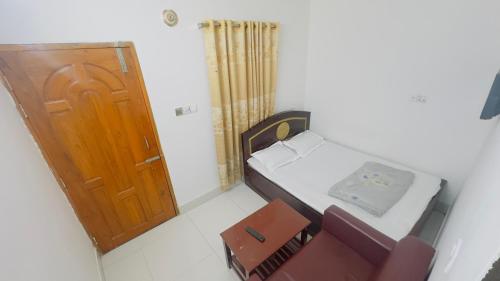 Postel nebo postele na pokoji v ubytování Hotel Prime Inn Mirpur