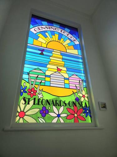 a stained glass window with the words lombards at GENSING LODGE STUNNING SEASIDE MAISONETTE in St. Leonards