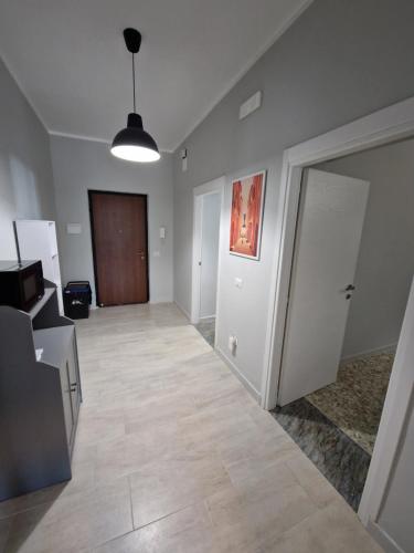 an empty room with a hallway with a door at La Spiritiera in Minturno