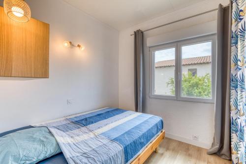 Ένα ή περισσότερα κρεβάτια σε δωμάτιο στο Maison avec terrasse climatisation