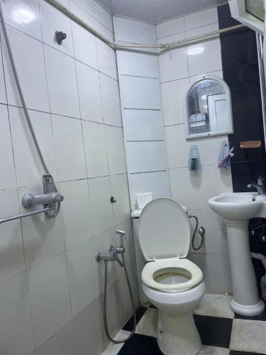 a bathroom with a toilet and a sink at Lucky Nest in Baku