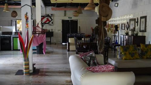 a living room with two couches and a table at Antara del Mar in San Bernardo del Viento