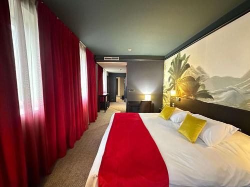 a hotel room with a large bed with red curtains at Mercure Bordeaux Chateau Chartrons in Bordeaux