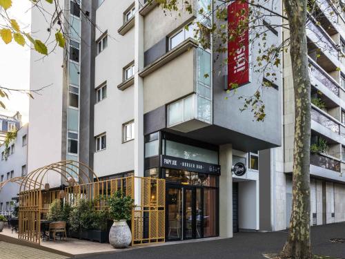a facade of a building with a storefront at ibis Paris Place d’Italie 13ème in Paris