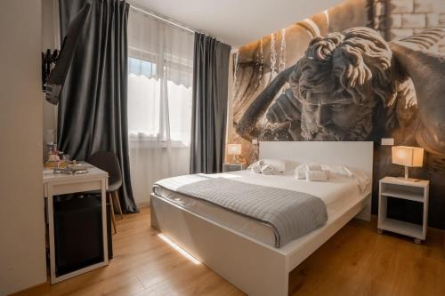 a bedroom with a bed with a lion head on the wall at Borghi di Belmonte in Palermo