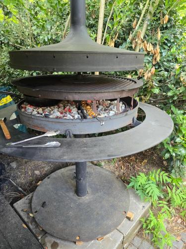 a stone oven with a burner on top of it at Areal Botanika in Unhošť