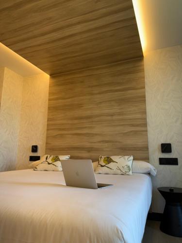 Cama o camas de una habitación en Hotel Delfin Azul