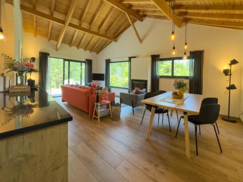 a living room with a table and a couch at O Celeiro