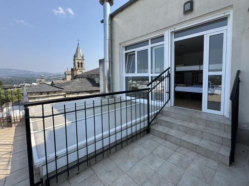 a balcony with a view of a building at Albergue Internacional in Sarria