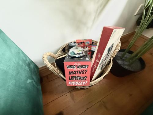 a wicker basket on the floor with a box of marshmallows at Roof Garden @ No.60 High Street in Lyndhurst