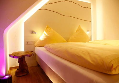 a bedroom with a white bed with at Flair Hotel Nieder in Bestwig