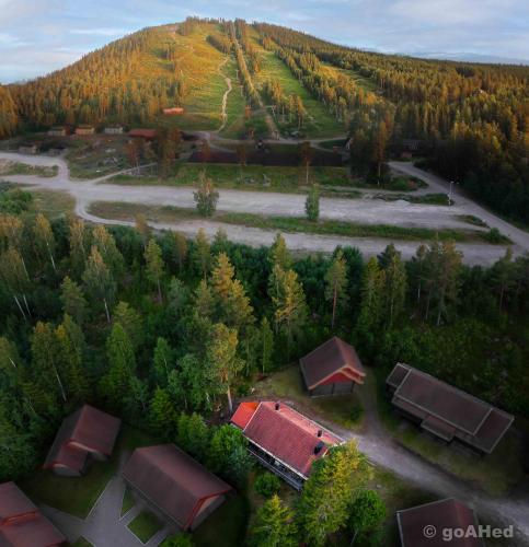 an aerial view of a house in a forest at Tomtelandstugan in Mora