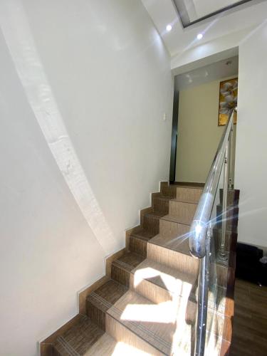 a staircase in a house with a glass railing at Our Home Zudelyn H8 in Los Frailes