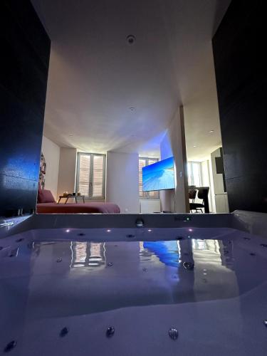 a view of a living room with a tub at The Ponote Escape in Le Puy en Velay