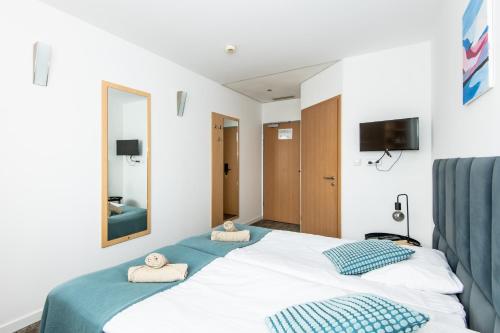 Ένα ή περισσότερα κρεβάτια σε δωμάτιο στο Sapphire Hotel Room Poznan