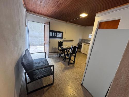 a room with chairs and a table and a whiteboard at La morada del Norte in Roque Sáenz Peña