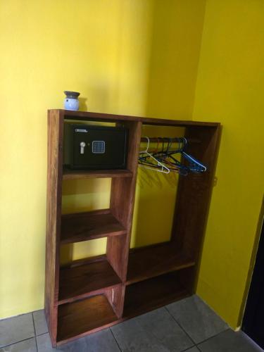 a small cabinet with a tv in a room at Rusticas Dani & Fam in Tanque