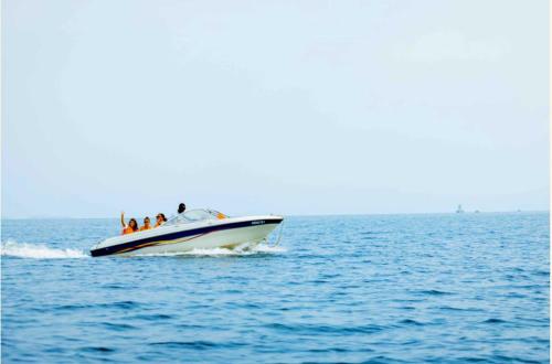 a group of people on a boat in the water at Lake kivu Boat Services in Gisenyi