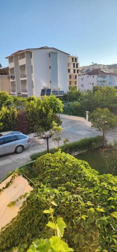a view of a parking lot with trees and a building at Villa2 in Golem