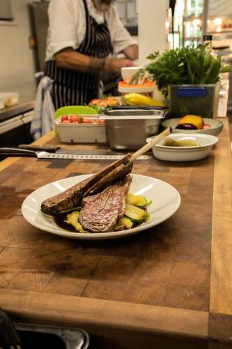 a plate of meat and vegetables on a table at Fritton Lake - The Clubhouse in Great Yarmouth