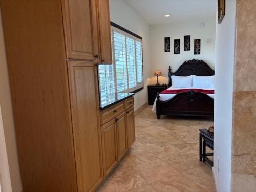 a bedroom with a bed and a large window at Bliss By The Sea in Saint Augustine