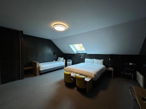 Katil atau katil-katil dalam bilik di Hostellerie St Vincent