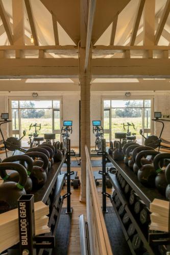 a row of treadmills in a gym at Fritton Lake - The Clubhouse in Great Yarmouth
