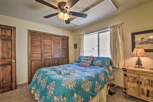 a bedroom with a bed and a ceiling fan at Angel Fire Mtn Escape Walk to Chile Express Lift! in Angel Fire