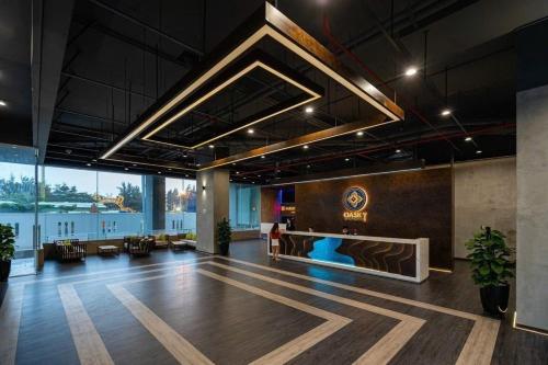 a large lobby with a table and chairs in a building at Oasky Vũng Tàu 3 bedrooms - Pooh House 2 in Vung Tau