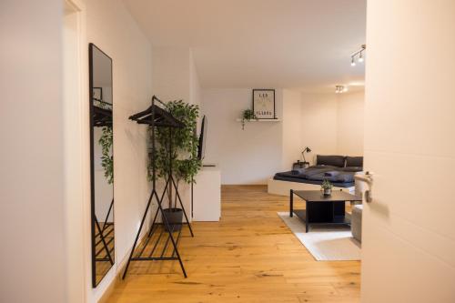 a living room with a couch and a table at Gemütlich wohnen im Herzen des Hunsrücks in Emmelshausen