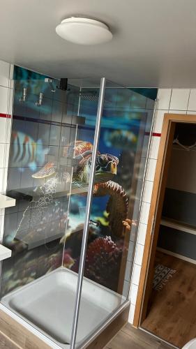 a wall with a painting of an octopus on it at Fewo Stein in Altenbeken