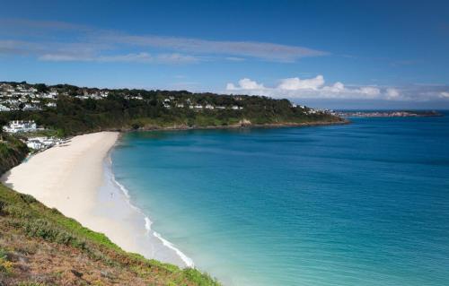 an aerial view of a beach and the ocean at Inn For All Seasons in Redruth