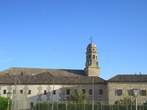 a building with a clock tower on top of it at La Casa del Seise in Baeza