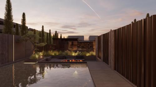 a backyard with a pool and a fence at NEMA Design Hotel & Spa - Adults Only in Hersonissos