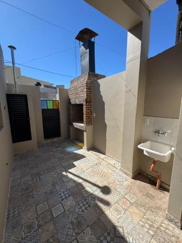 a bathroom with a sink and a fireplace on a building at Hotel Ideal Resto Bar in Colorado River