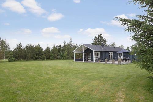 a house in a field with a large yard at JB283-Frostrup-Andreas-Lassens-Vej-6 in Nørklit