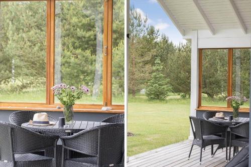 a porch with a table and chairs and a window at JB283-Frostrup-Andreas-Lassens-Vej-6 in Nørklit