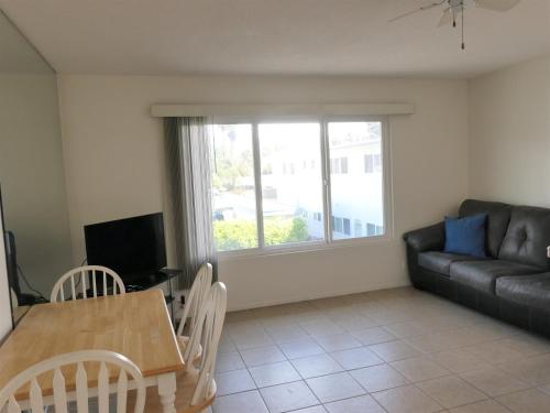 a living room with a table and a couch at 4902 Sandyland Road #247 in Carpinteria