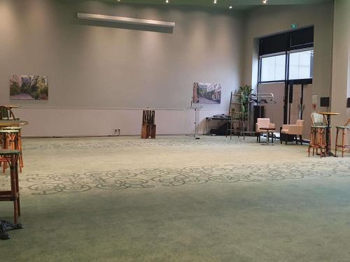 a large room with a stage in the middle of it at ibis Styles Evry Courcouronnes Hotel and Events in Evry-Courcouronnes