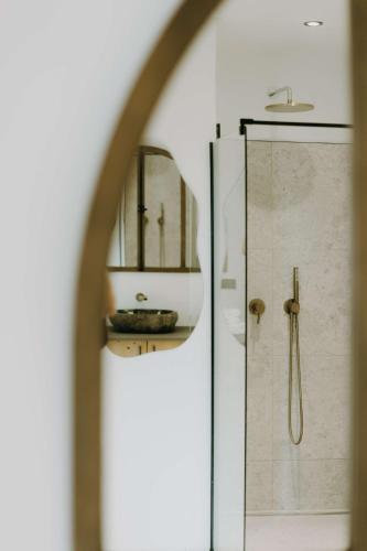 a bathroom with a shower and a mirror at Bierhotel in Oberstdorf
