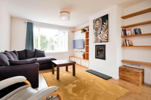 a living room with a couch and a table at Finest Retreats - Elizabeth House in Kington