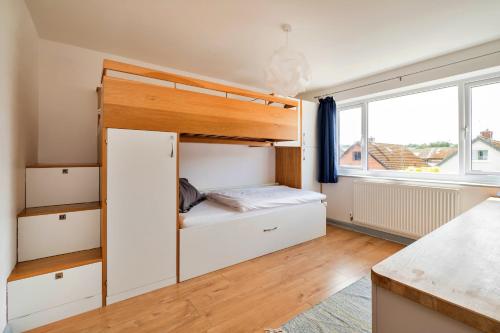 a bedroom with a bunk bed and a window at Finest Retreats - Elizabeth House in Kington