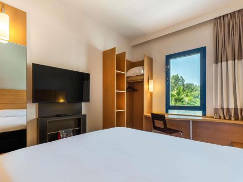 Ein Bett oder Betten in einem Zimmer der Unterkunft Ibis Fes