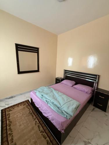 Una cama o camas en una habitación de Haven Saly