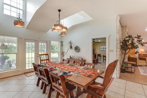 a dining room with a wooden table and chairs at 5 Acres! Countryside Getaway Outside Fort Worth in Crowley