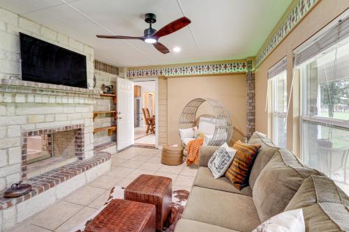 a living room with a couch and a fireplace at 5 Acres! Countryside Getaway Outside Fort Worth in Crowley